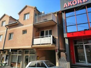 a building with a car parked in front of it at Apartment Matovic in Kragujevac