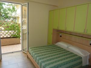 A bed or beds in a room at Beaurivage