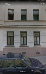 a black car parked in front of a building at Radiant Premium Apartments - Fünfhaus in Vienna