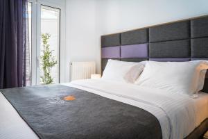 מיטה או מיטות בחדר ב-Talos Luxury Suites