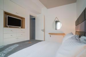 מיטה או מיטות בחדר ב-Talos Luxury Suites