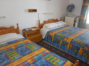 Postel nebo postele na pokoji v ubytování Miramare Hotel