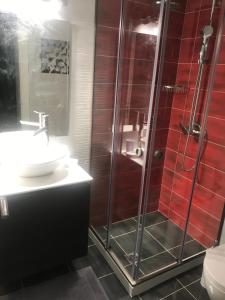 a bathroom with a shower and a sink at Terpsichore Boutique Appartments in Dassia +57 photos