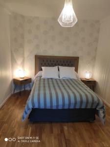 Ένα ή περισσότερα κρεβάτια σε δωμάτιο στο LE CANGE