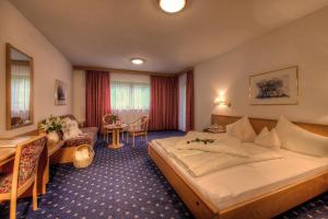 Postel nebo postele na pokoji v ubytování Hotel Gletscherblick