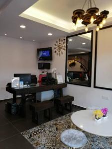 an office with a desk and a mirror at M Design Hotel @ Taman Pertama in Kuala Lumpur