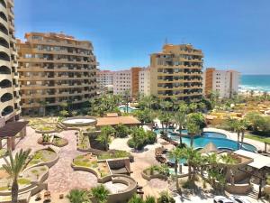 a view of a resort with a pool and buildings at BELLA SIRENA RESORT in Puerto Peñasco