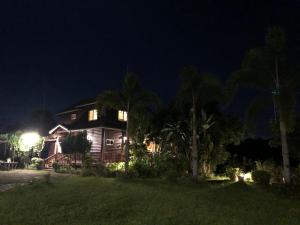 a house at night with its lights on at Yiyue Guanhe Homestay 倚月觀荷民宿 in Danei