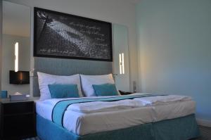 מיטה או מיטות בחדר ב-Red & Blue Design Hotel Prague