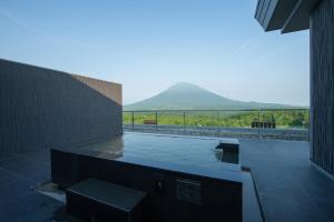 a swimming pool with a view of a mountain at Aya Niseko in Niseko