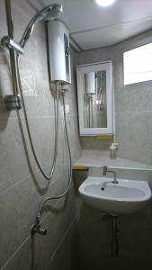 a bathroom with a sink and a shower at 18floor condo close to MRTwith 2 bedrooms in Hua mak in Bangkok