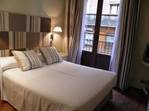 Säng eller sängar i ett rum på Hotel Annex - Rey Don Jaime I