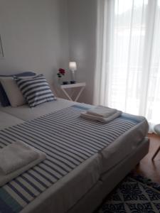 Postel nebo postele na pokoji v ubytování MEROPI STUDIOS