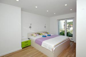 Cama o camas de una habitación en Apartments Miranda