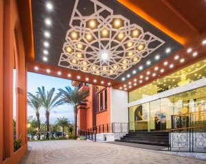 a building with a chandelier hanging from the ceiling at Alfahad Hotel in Hat Yai