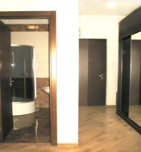 a room with two glass doors in a building at Tbilisi Comfort in Tbilisi City +8 photos