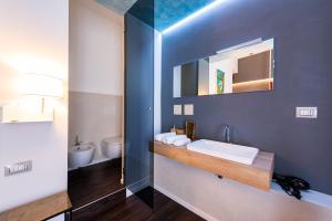 a bathroom with a sink and a mirror at Sinestesia in Polignano a Mare