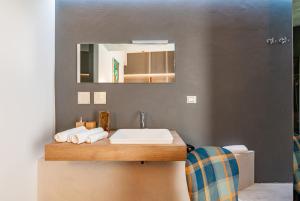 a bathroom with a sink and a mirror at Sinestesia in Polignano a Mare