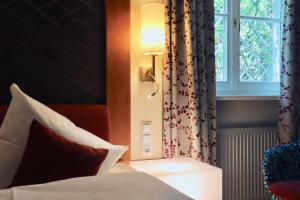 Voodi või voodid majutusasutuse Hotel König toas