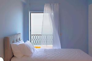 A bed or beds in a room at T8 APARTMENT ON THE BEACH