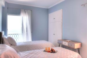 A bed or beds in a room at T8 APARTMENT ON THE BEACH