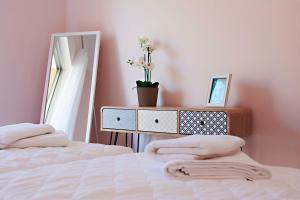 A bed or beds in a room at T8 APARTMENT ON THE BEACH