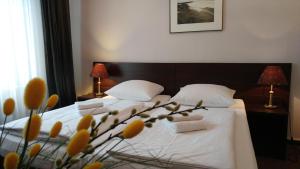 Postel nebo postele na pokoji v ubytování Hotel Xantener Eck