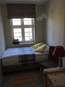 Łóżko lub łóżka w pokoju w obiekcie Five Point Hostel & Apartments