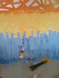 a painting of two wine glasses and a bottle of wine at Apartmani Jovanovic in Petrovac na Moru