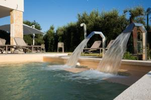 a water slide in a swimming pool at Scissure Sea Suite in Gaeta