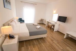 Postel nebo postele na pokoji v ubytování Blue Sea Hotel