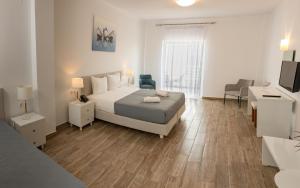 Postel nebo postele na pokoji v ubytování Blue Sea Hotel