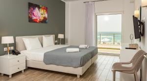 Postel nebo postele na pokoji v ubytování Blue Sea Hotel
