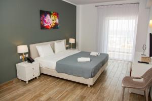 Postel nebo postele na pokoji v ubytování Blue Sea Hotel