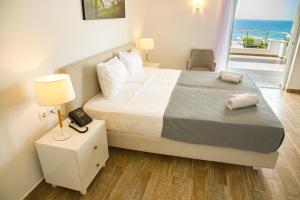 Postel nebo postele na pokoji v ubytování Blue Sea Hotel
