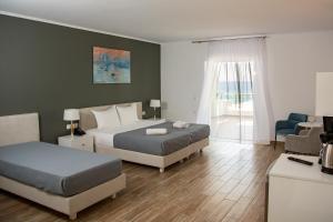 Postel nebo postele na pokoji v ubytování Blue Sea Hotel