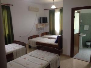 Postel nebo postele na pokoji v ubytování Hotel Moris