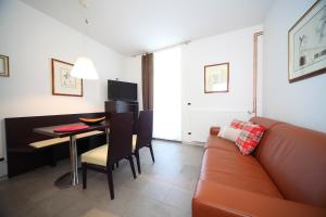 a living room with a couch and a table at Klass 103 in Kranjska Gora