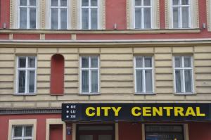 a city central sign in front of a building at City Central De Luxe in Prague