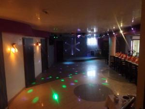 a room with a dance floor with green lights at Hotel & Restauracja Euforia in Garwolin