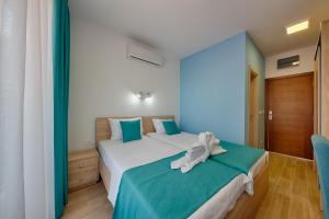 Letto o letti in una camera di Hotel Obala