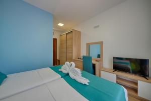 Postel nebo postele na pokoji v ubytování Hotel Obala