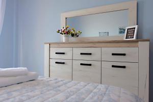 A bed or beds in a room at T8 APARTMENT ON THE BEACH