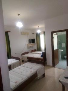 Postel nebo postele na pokoji v ubytování Hotel Moris