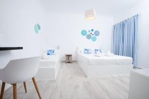 Giường trong phòng chung tại Villa Markezinis