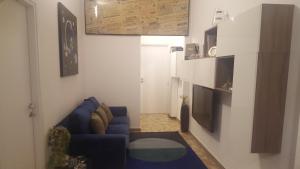 Televízia a/alebo spoločenská miestnosť v ubytovaní Nuvola B&B