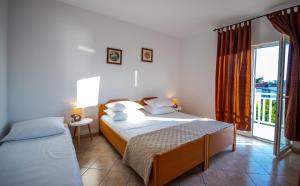 Postel nebo postele na pokoji v ubytování Apartment Franić