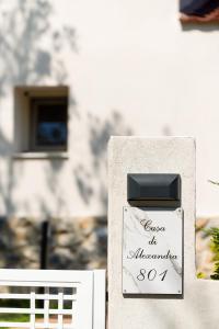 a sign on the side of a building at Alexandra Beach Spa Resort in Potos