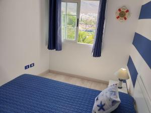 Tempat tidur dalam kamar di Casa Azul only 200 meters to the beach, free wifi, balcony