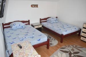 Giường trong phòng chung tại Vila Valentina